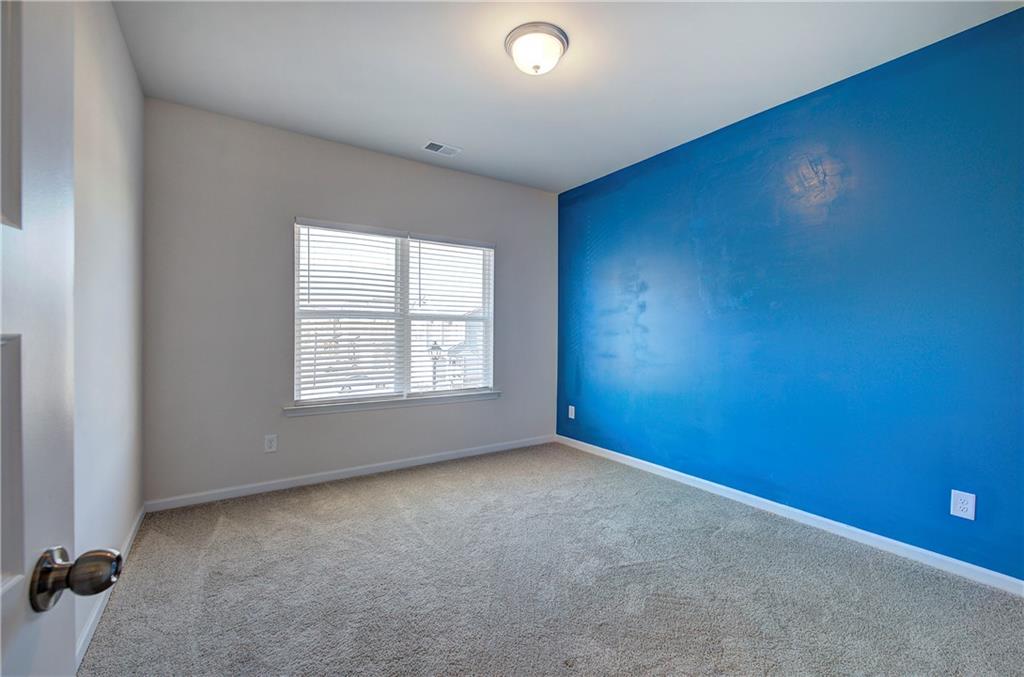 509 Alma Street Cartersville, GA 30121 - Photo 35 of 39 an empty room with a empty space and windows