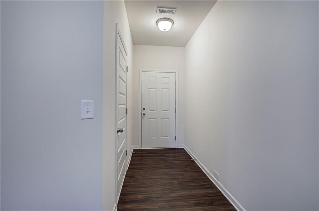 509 Alma Street Cartersville, GA 30121 - Photo 5 of 39 a view of a hallway with wooden floor