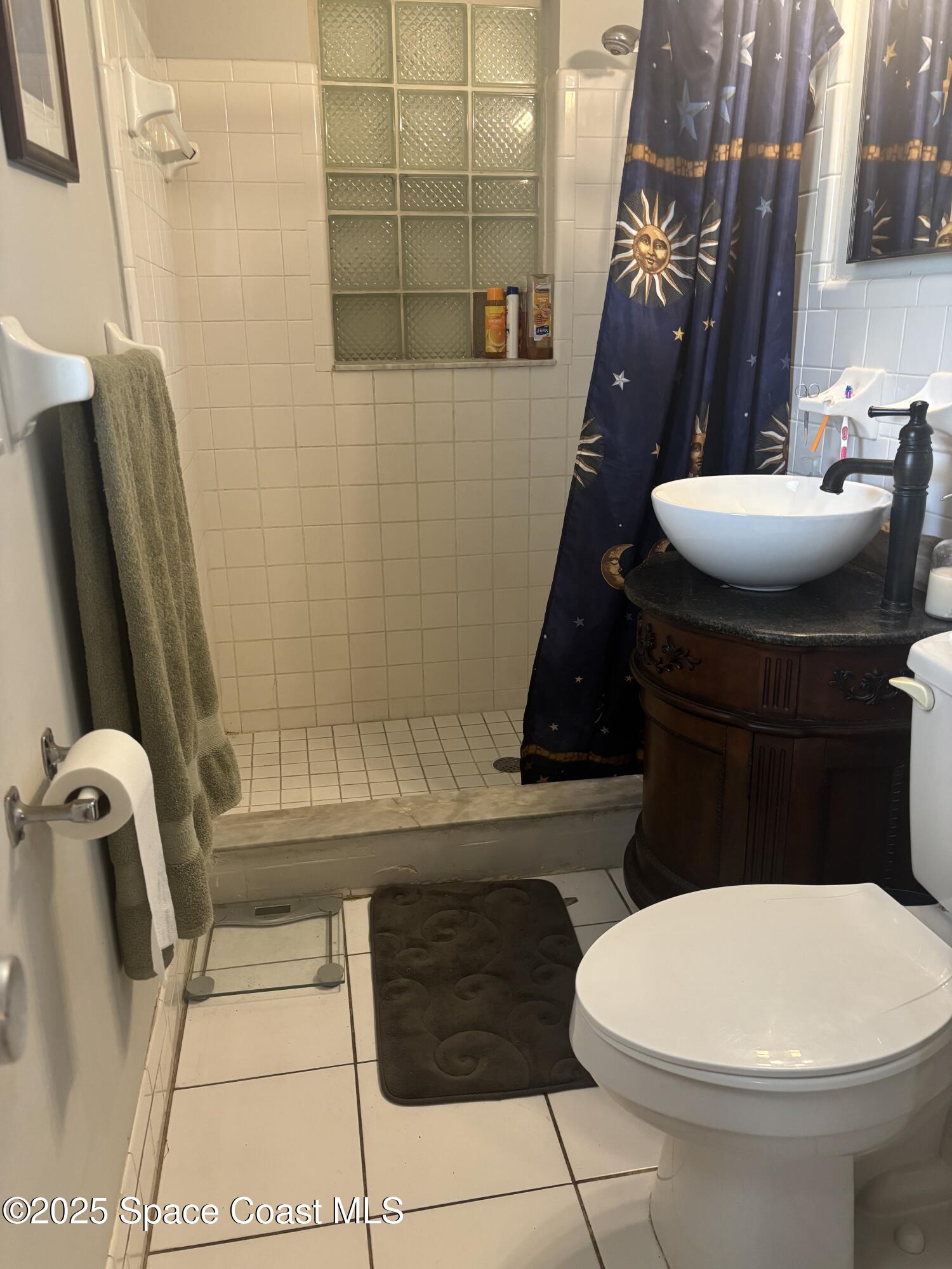 986 Macco Road Cocoa, FL 32927 - Photo 11 of 18 a bathroom with a toilet and a shower