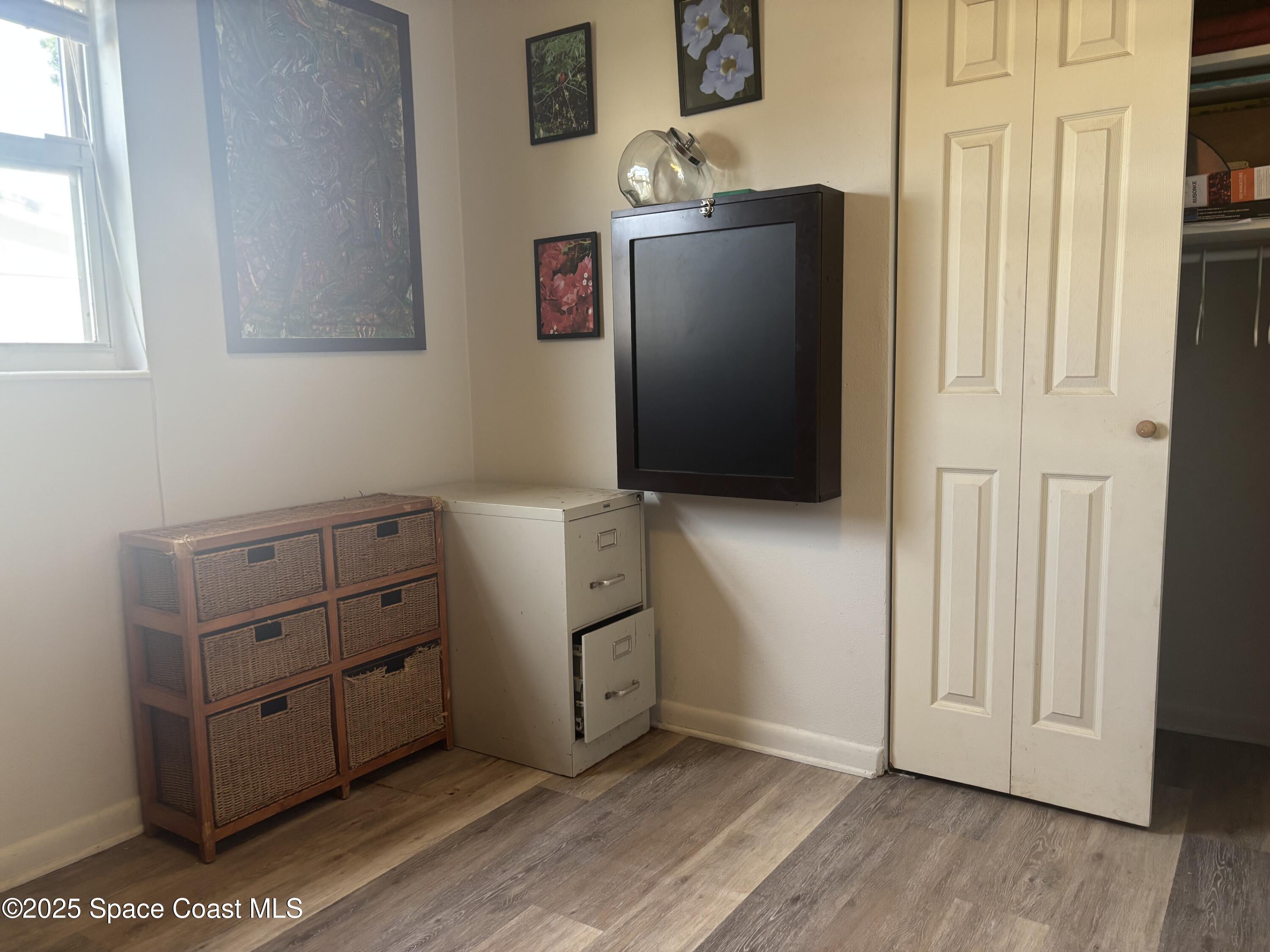 986 Macco Road Cocoa, FL 32927 - Photo 18 of 18 a room with cabinets and wooden floor
