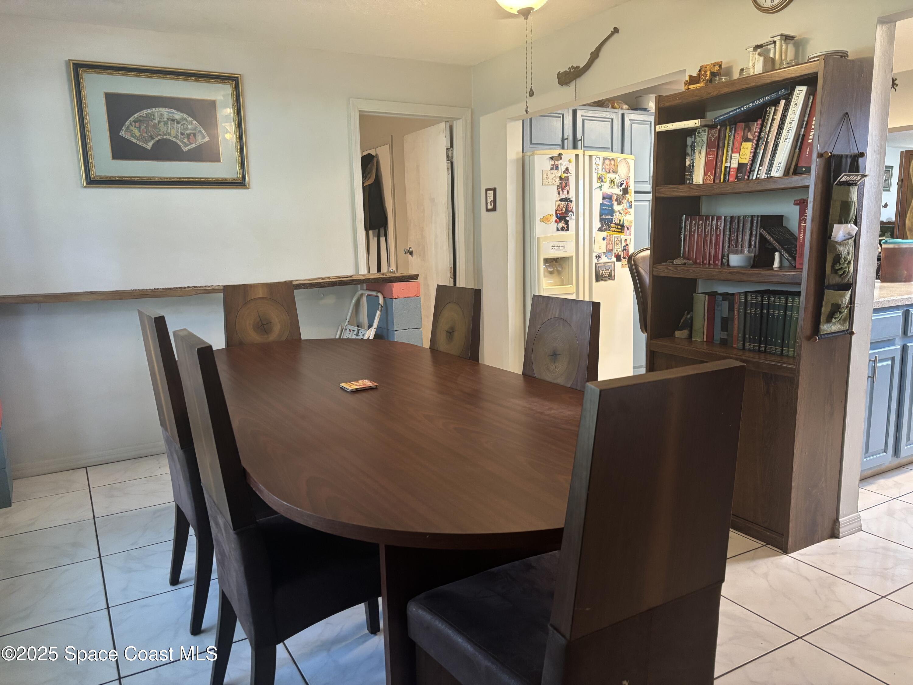 986 Macco Road Cocoa, FL 32927 - Photo 3 of 18 a view of a dining room with furniture