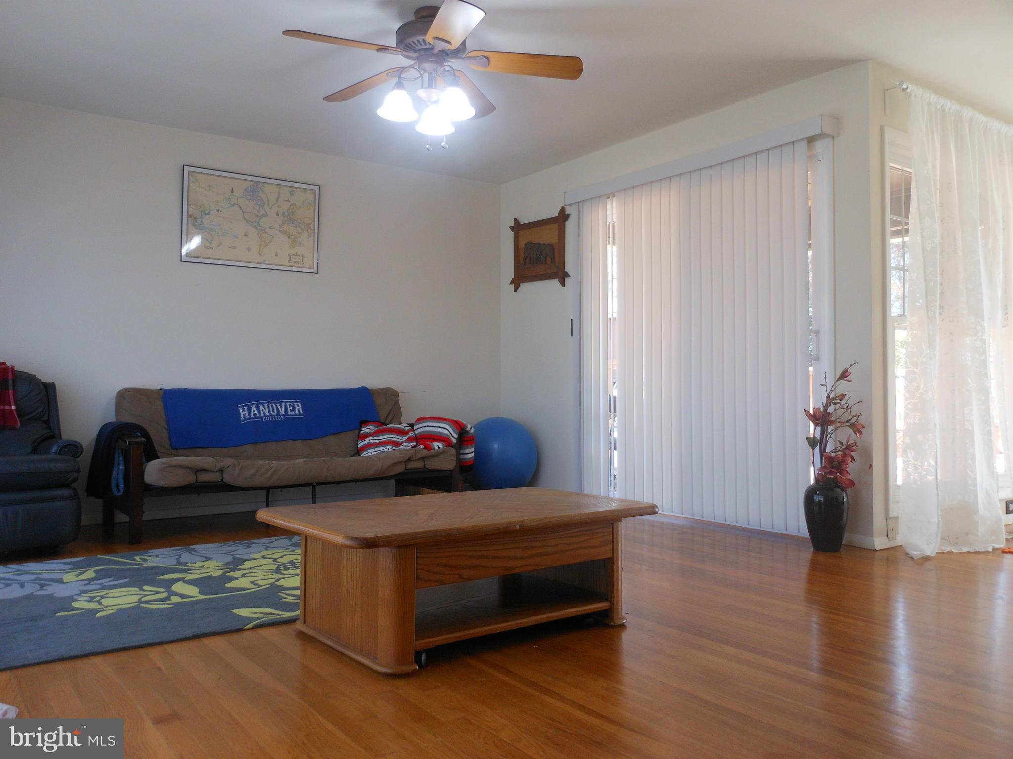 4306 Emden Street Silver Spring, MD 20906 - Photo 13 of 23 a living room with furniture and a wooden floor