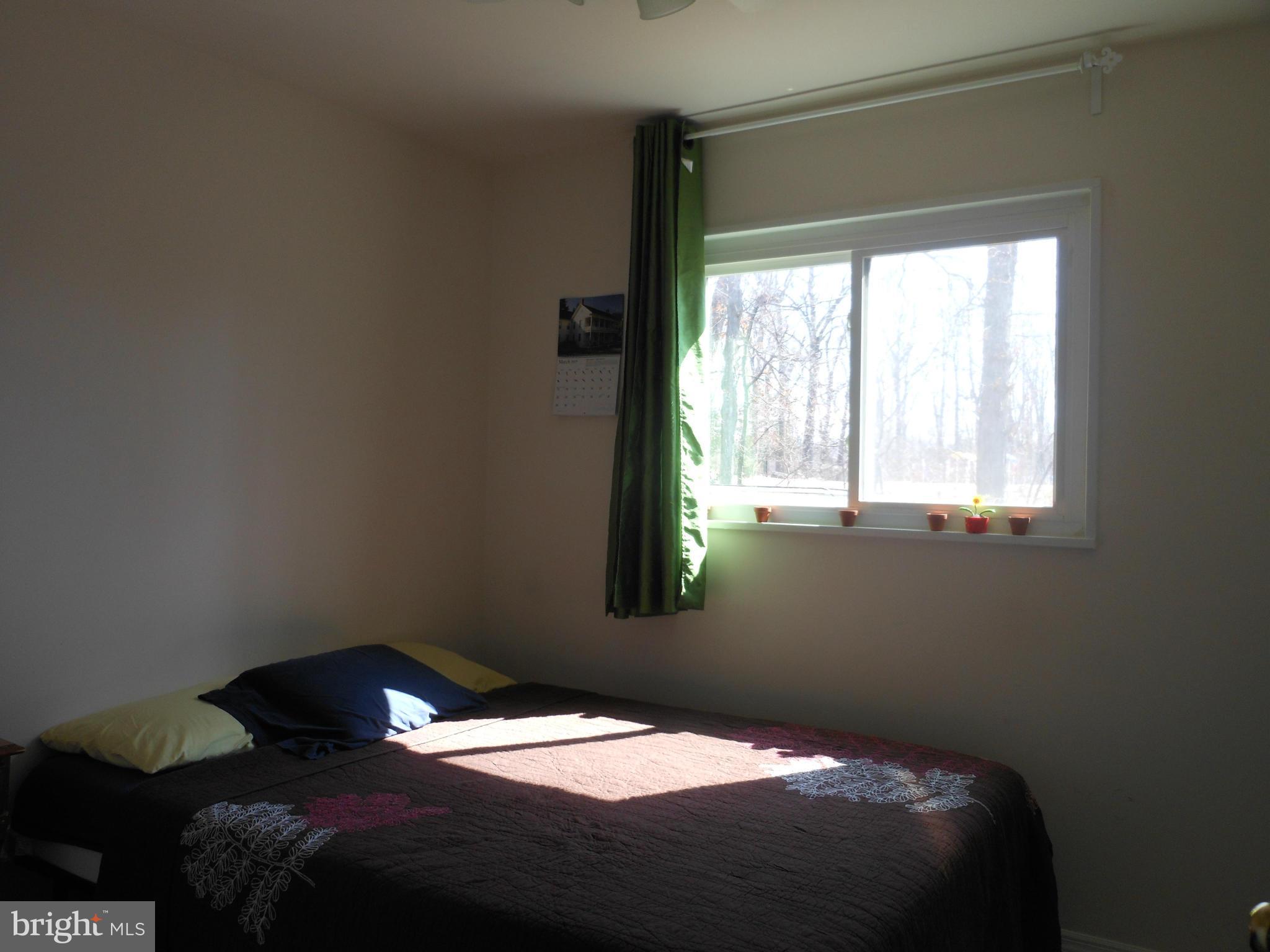 4306 Emden Street Silver Spring, MD 20906 - Photo 17 of 23 a bedroom with a bed and a window