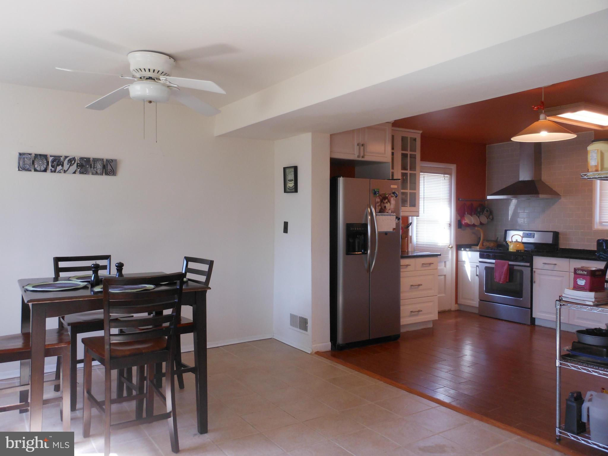 4306 Emden Street Silver Spring, MD 20906 - Photo 7 of 23 a view of a dining room with furniture and wooden floor
