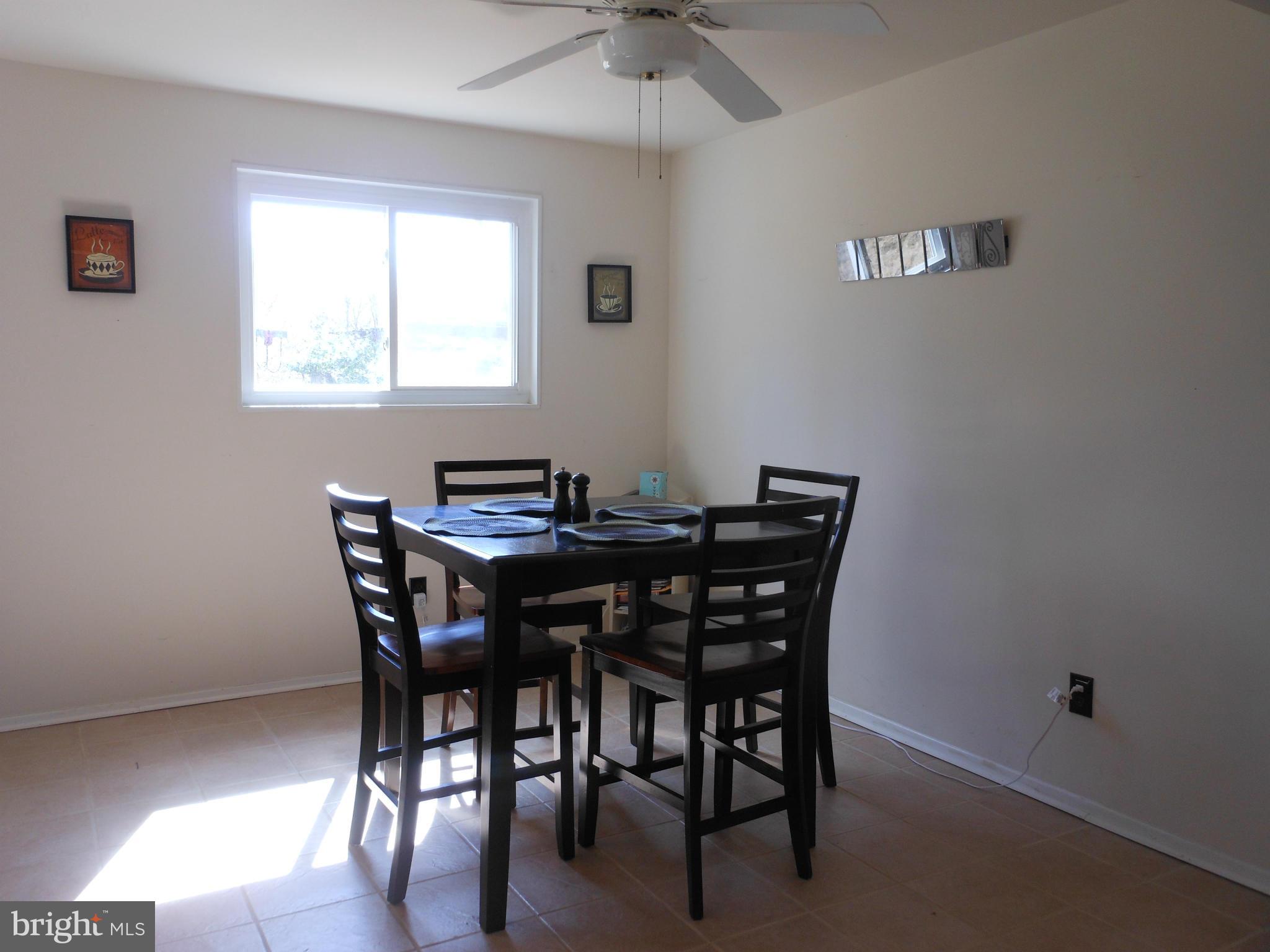 4306 Emden Street Silver Spring, MD 20906 - Photo 8 of 23 a view of a dining room with furniture and window
