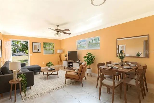 a view of a livingroom with furniture and a window