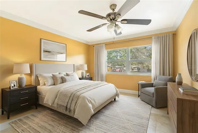 a bedroom with a large bed and a large window