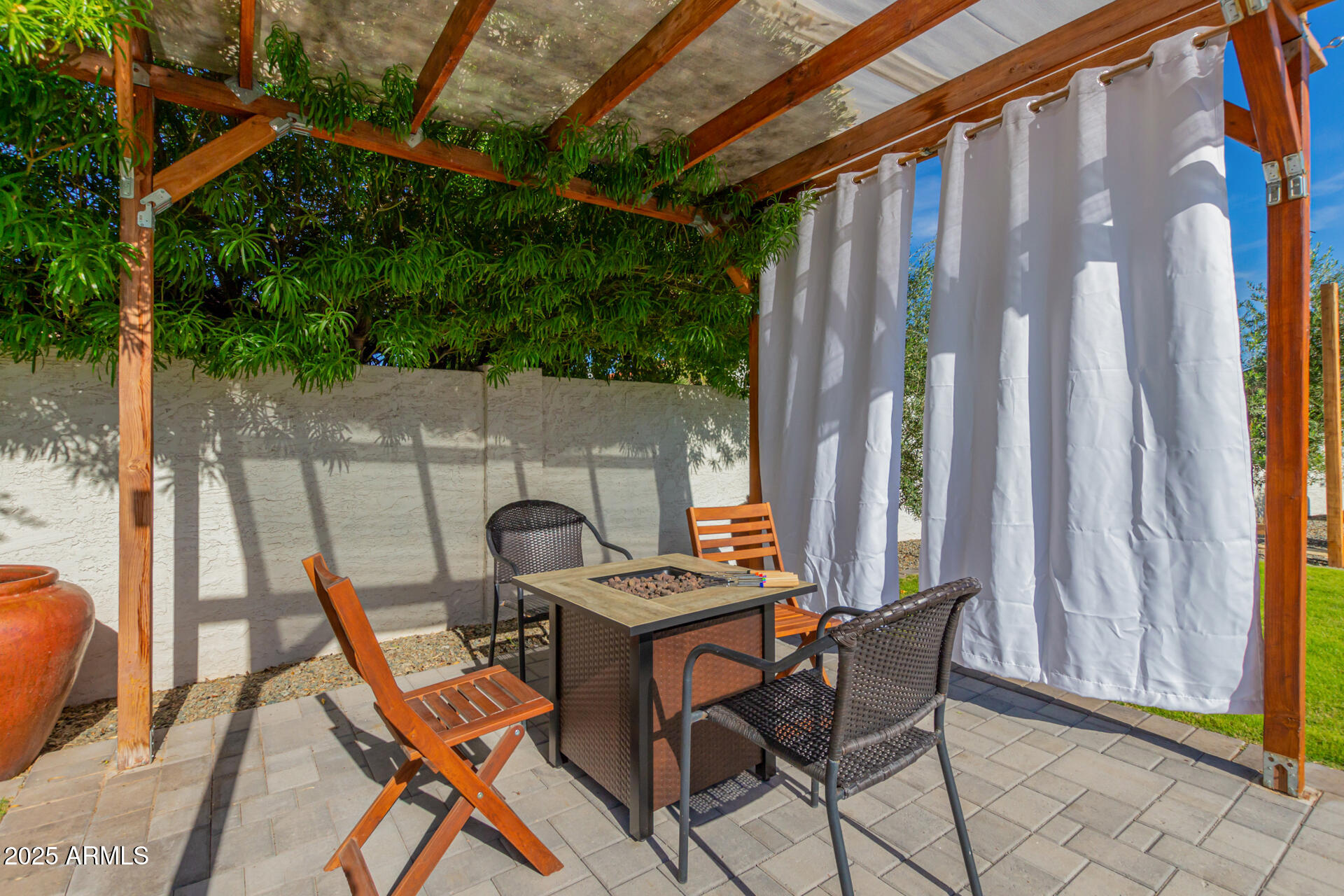 1948 East Jeanine Drive Tempe, AZ 85284 - Photo 11 of 45 a patio with table and chairs and potted plants