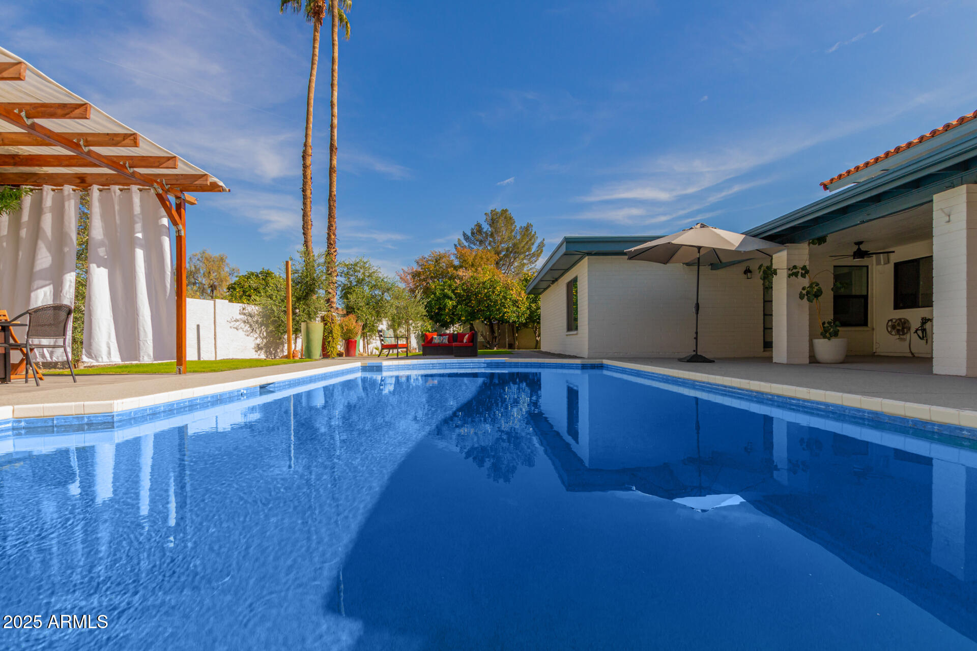 1948 East Jeanine Drive Tempe, AZ 85284 - Photo 13 of 45 a view of swimming pool with a chairs