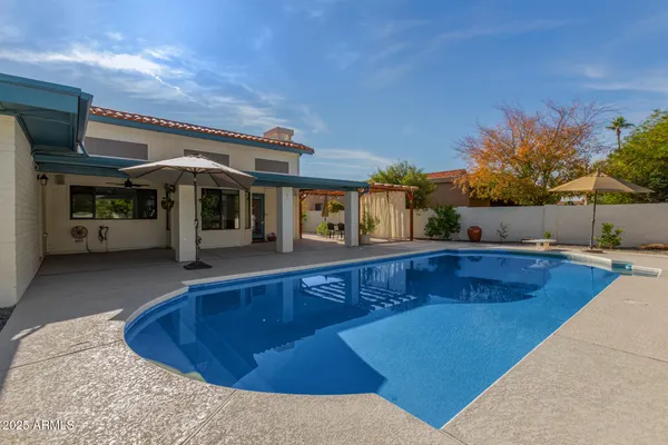 a view of a house with swimming pool