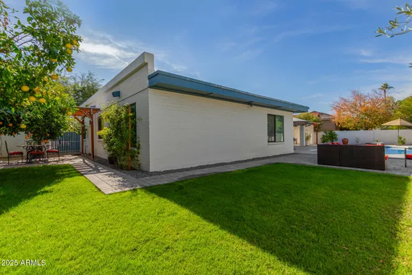 a backyard of a house with seating space