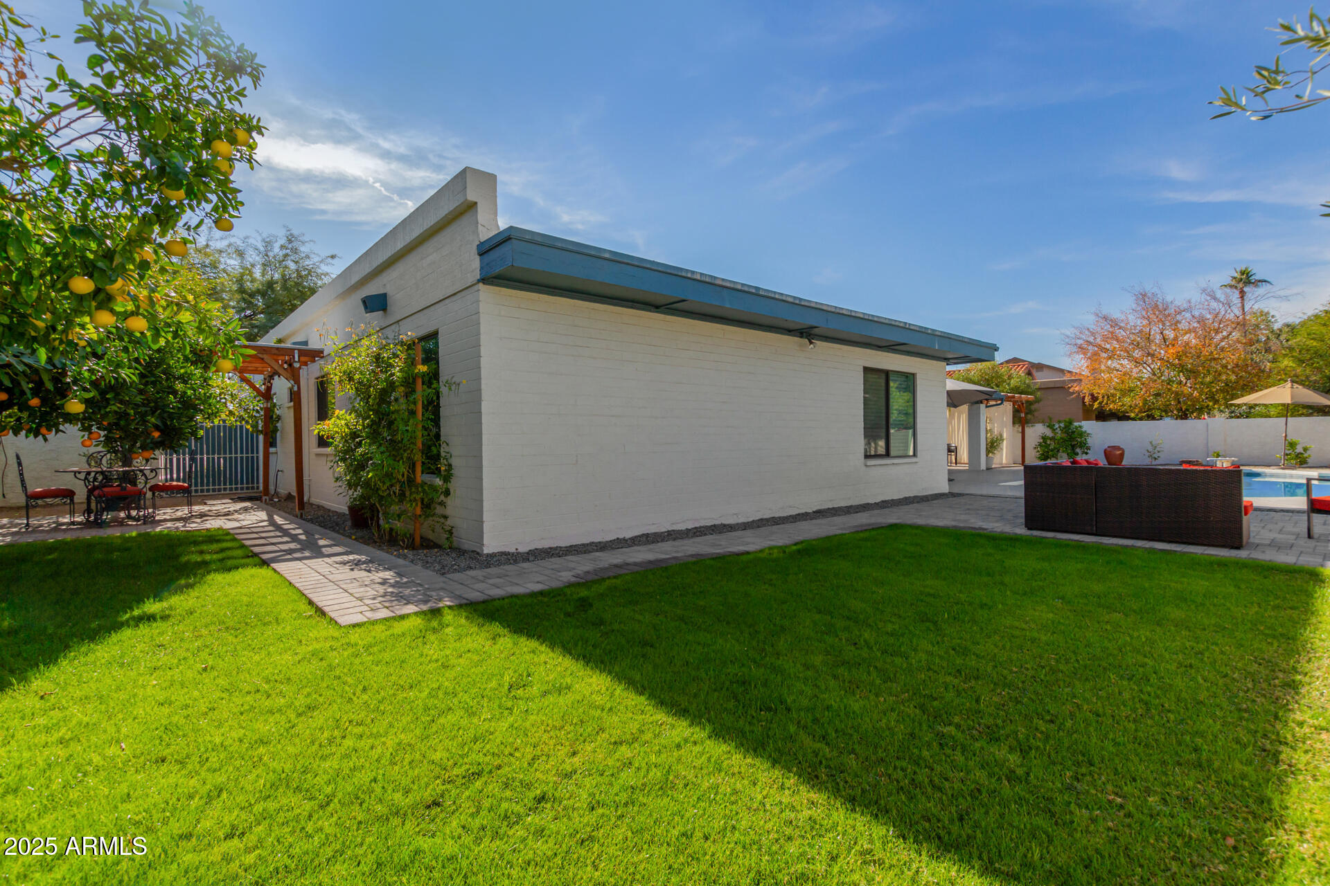 1948 East Jeanine Drive Tempe, AZ 85284 - Photo 16 of 45 a backyard of a house with seating space