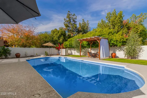 a view of a swimming pool with an outdoor space