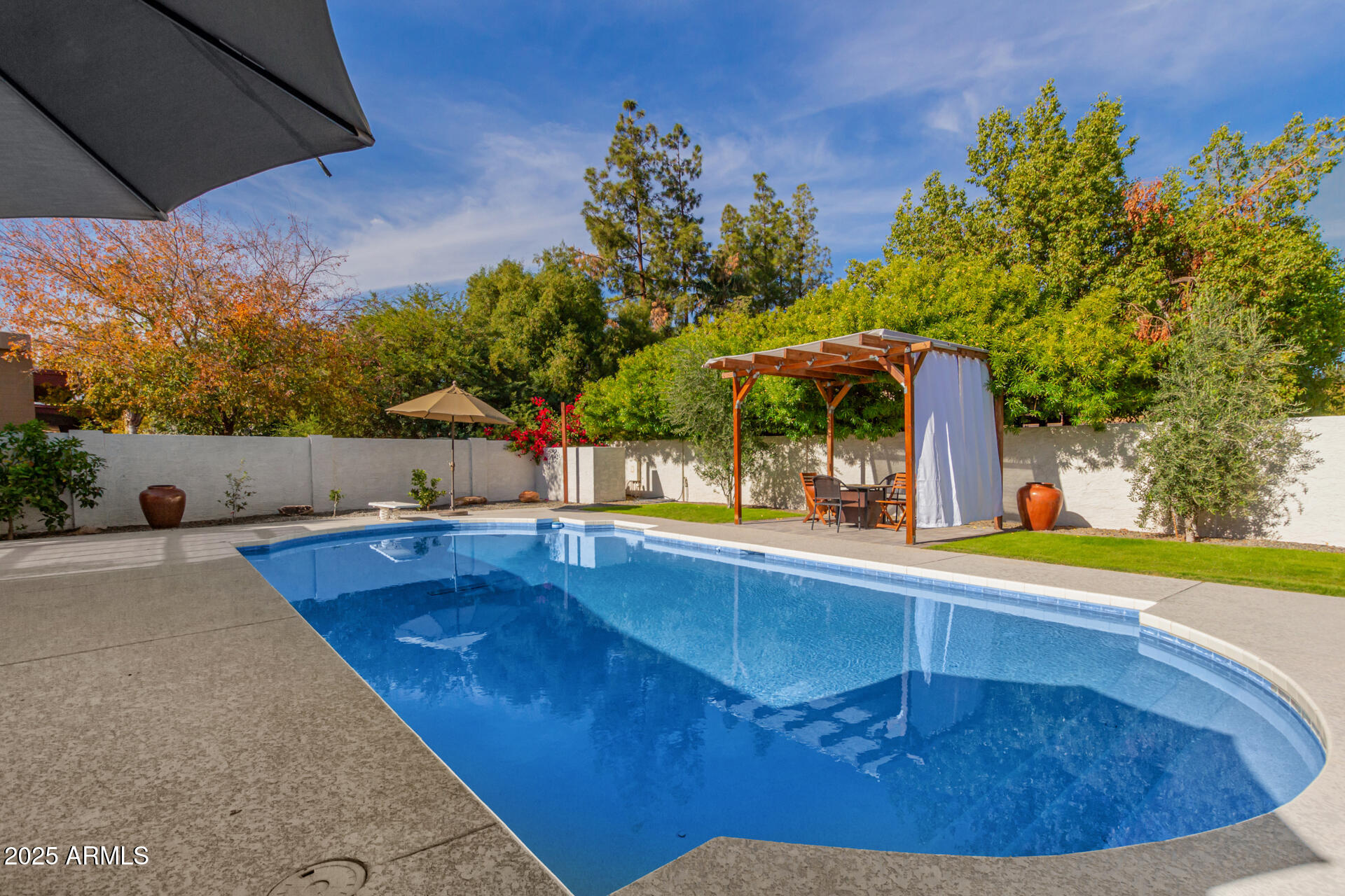 1948 East Jeanine Drive Tempe, AZ 85284 - Photo 18 of 45 a view of a swimming pool with an outdoor space