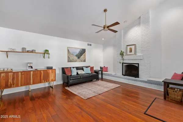 a living room with furniture and a fireplace