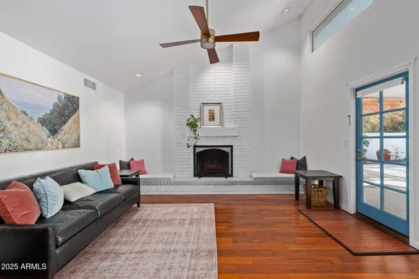 a living room with furniture and a fireplace