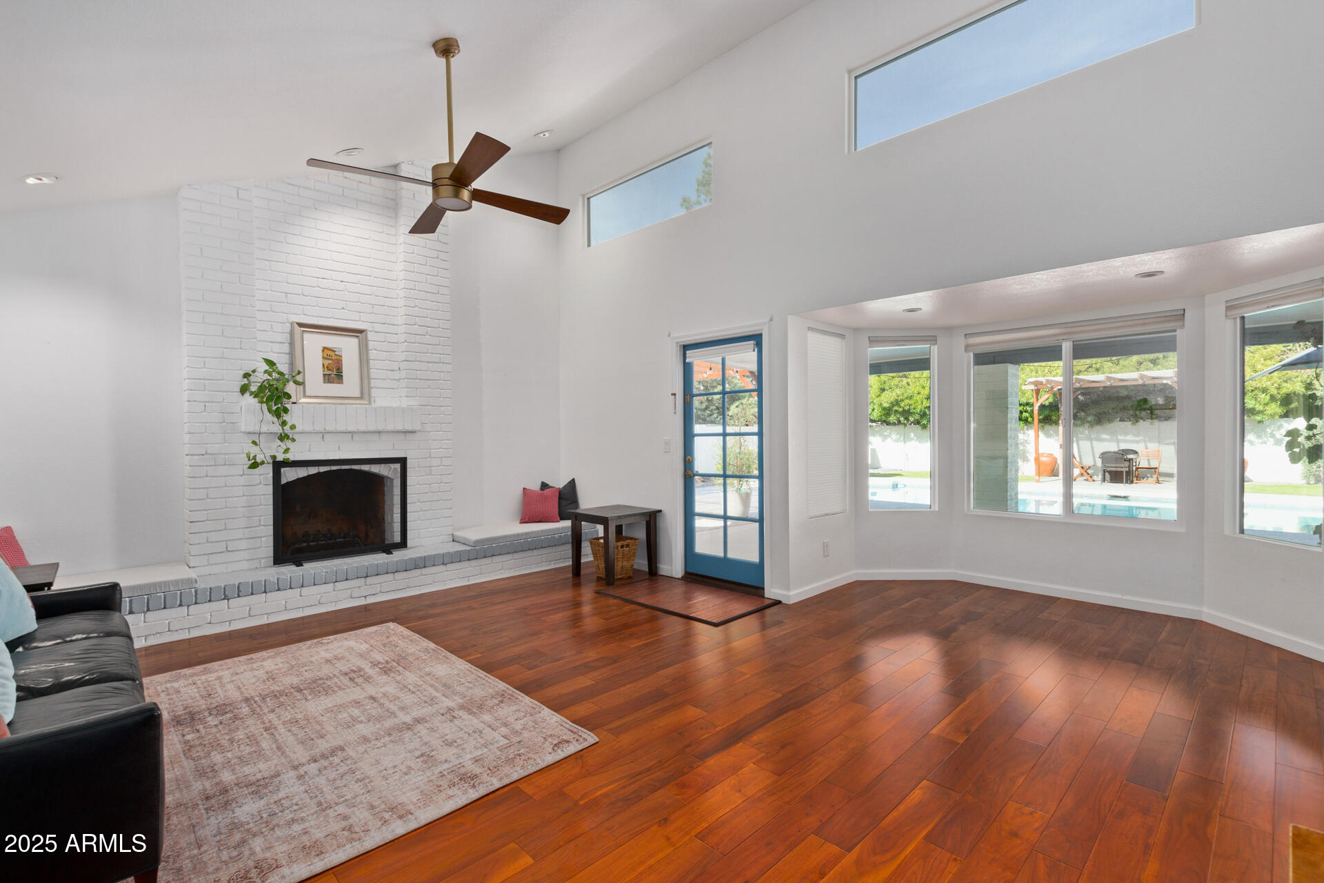 1948 East Jeanine Drive Tempe, AZ 85284 - Photo 25 of 45 wooden floor fireplace and windows in an empty room