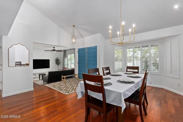 a view of a dining room with furniture window and wooden floor