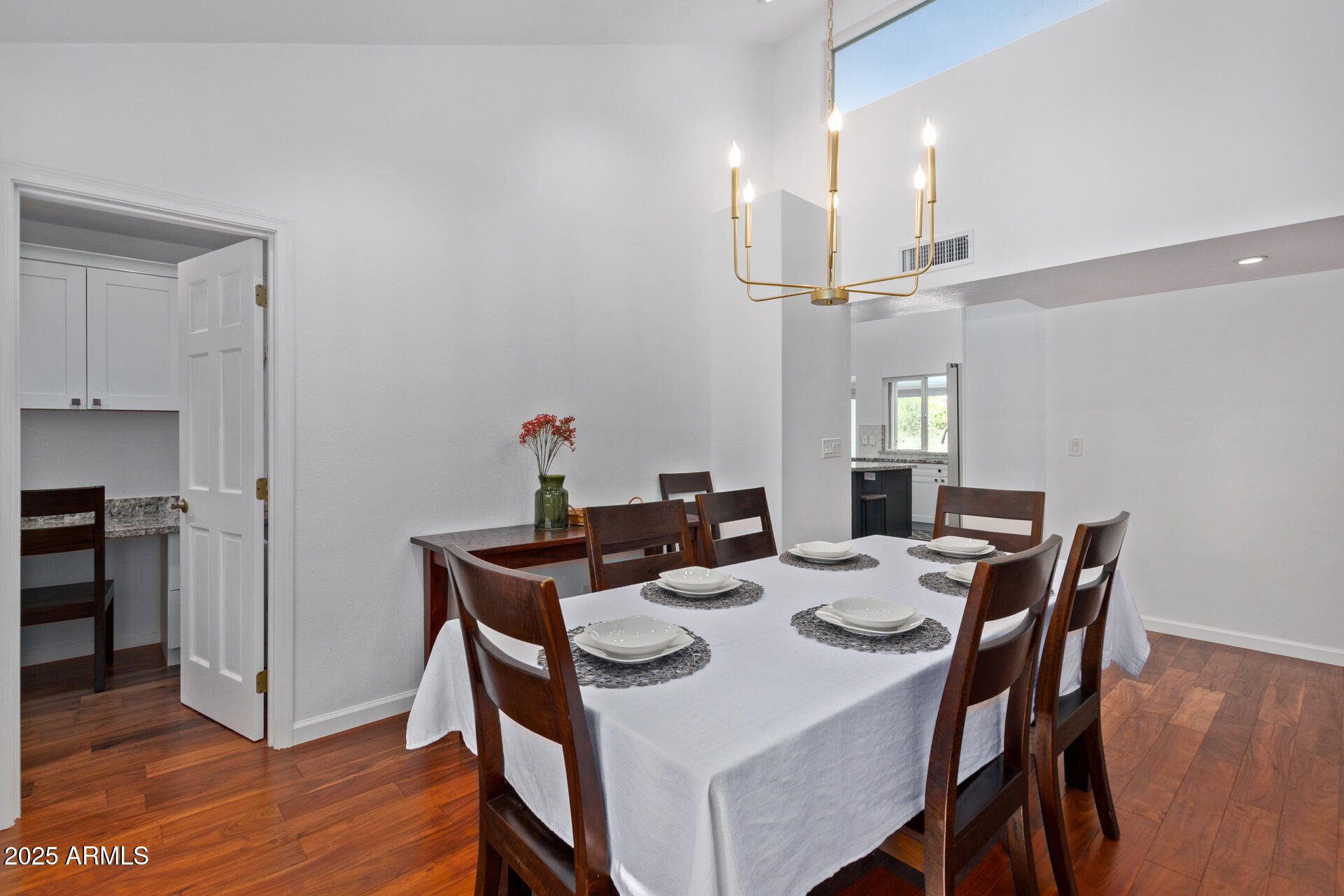 1948 East Jeanine Drive Tempe, AZ 85284 - Photo 32 of 45 a dining room with furniture and wooden floor