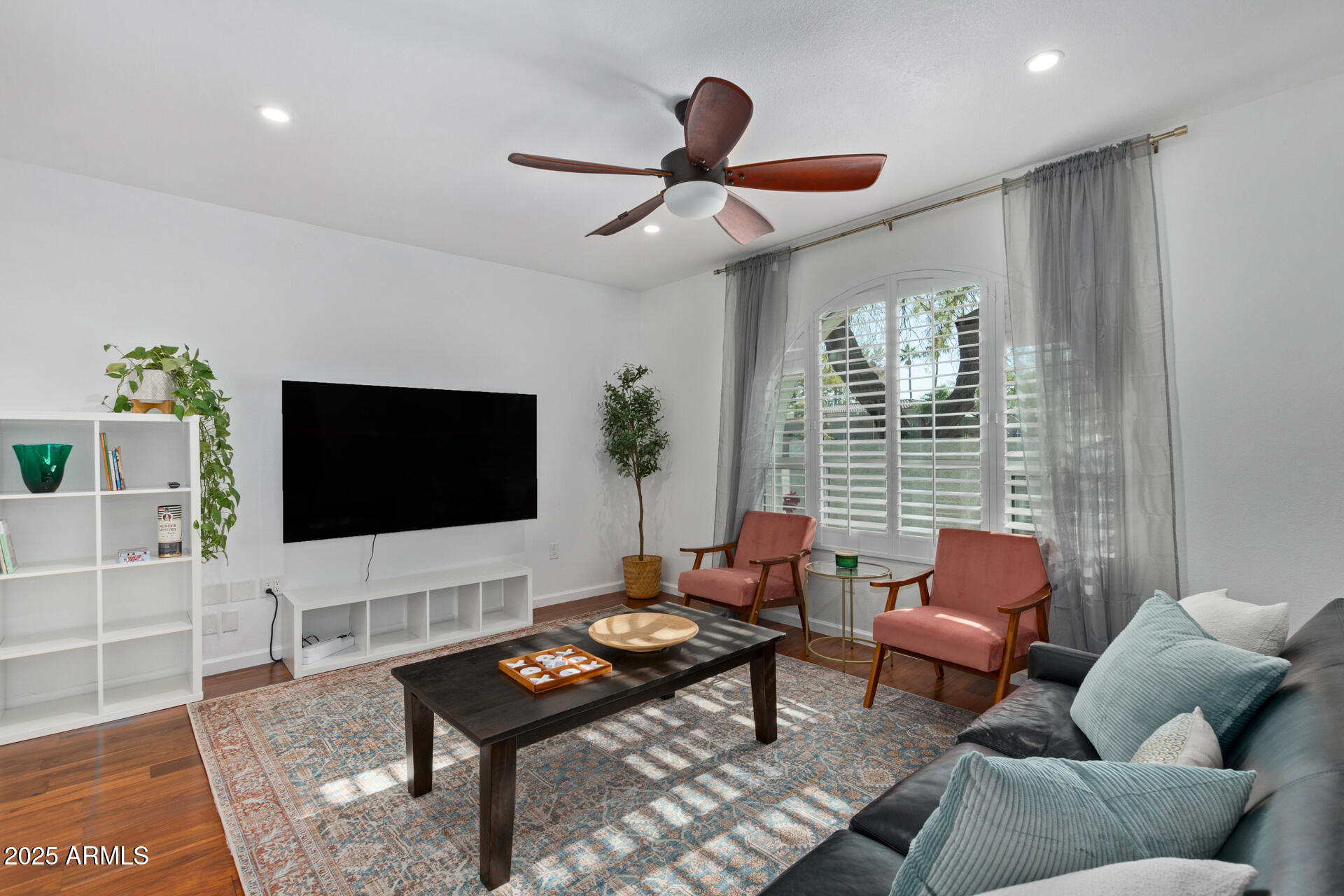 1948 East Jeanine Drive Tempe, AZ 85284 - Photo 34 of 45 a living room with furniture and a flat screen tv