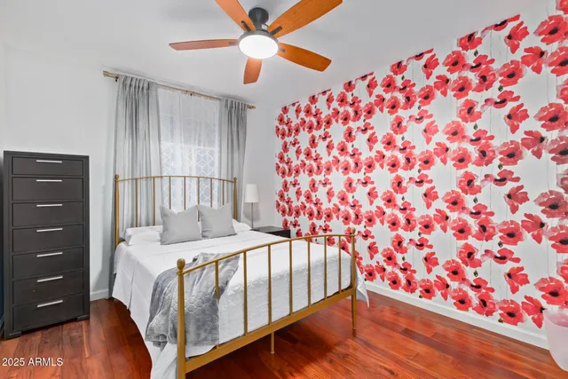 a bathroom with a granite countertop sink a toilet a mirror and shower