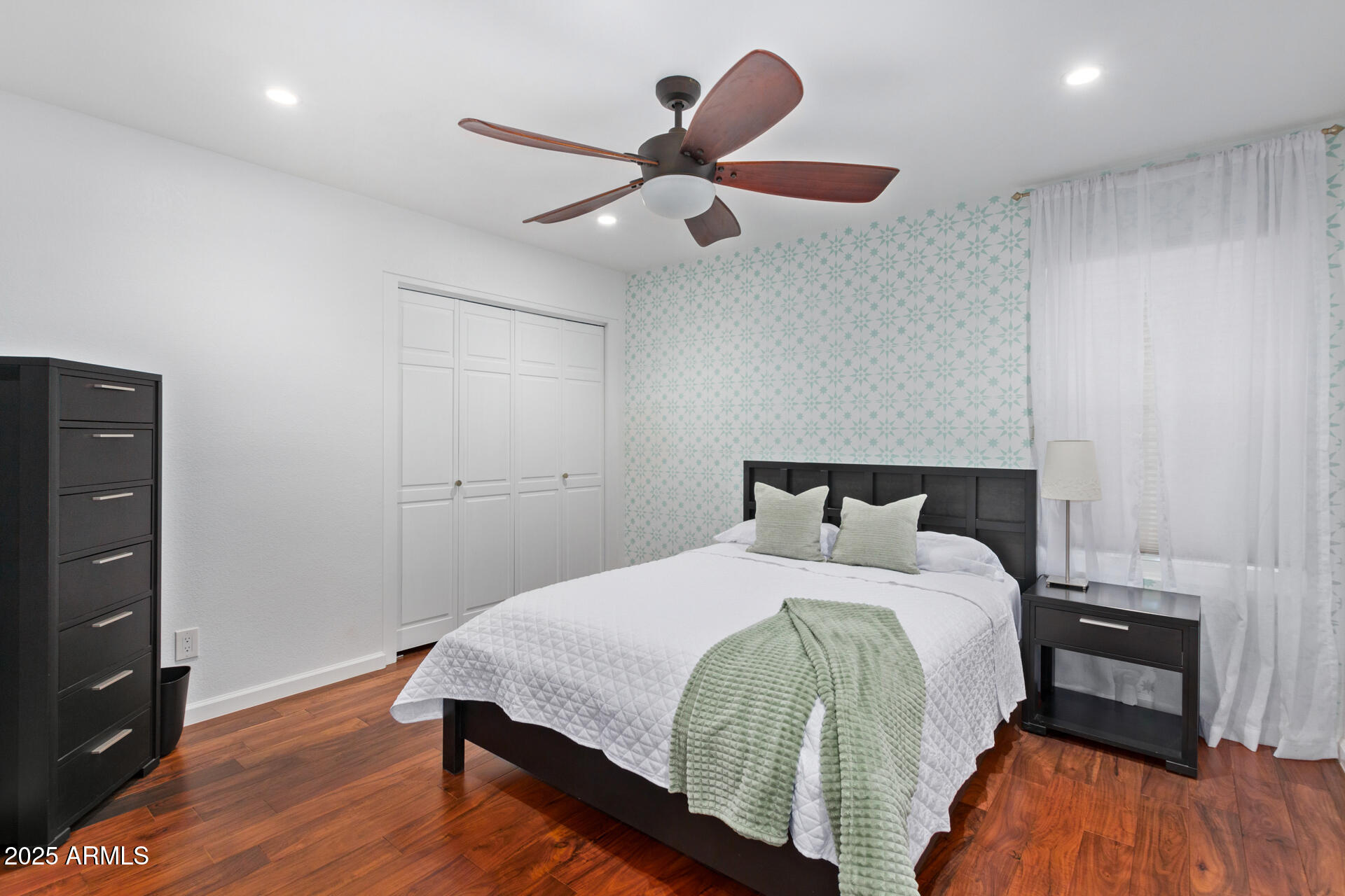 1948 East Jeanine Drive Tempe, AZ 85284 - Photo 42 of 45 a bed room with a bed and a ceiling fan