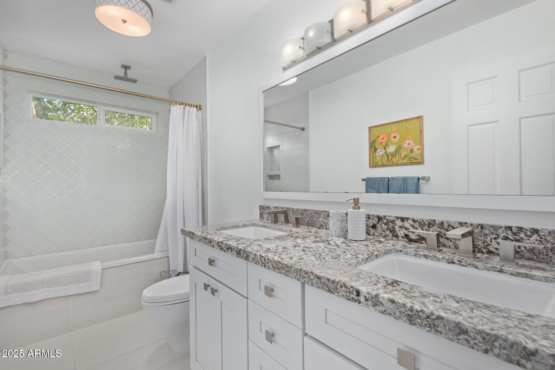 1948 East Jeanine Drive Tempe, AZ 85284 - Photo 43 of 45 a bathroom with a granite countertop sink a toilet a mirror and shower