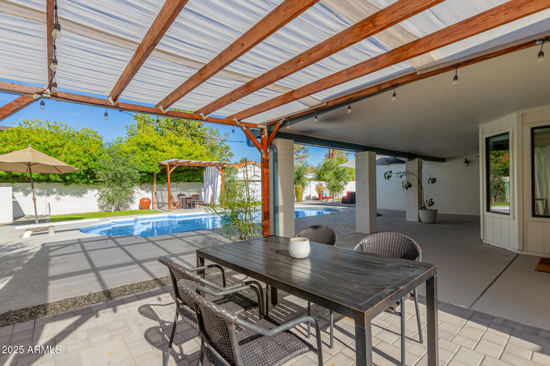 1948 East Jeanine Drive Tempe, AZ 85284 - Photo 7 of 45 a dining room with furniture and a floor to ceiling window