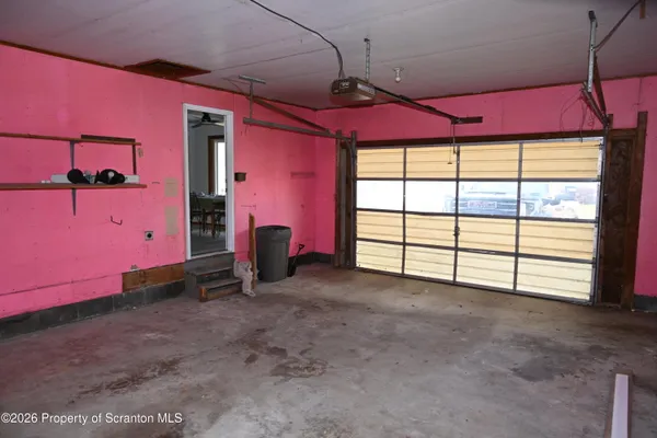 a view of a room with window and a table