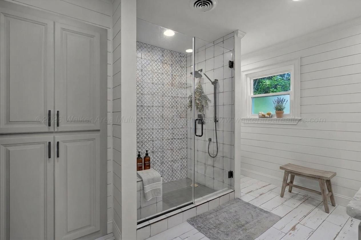 1751 North Walston Bridge Road Jasper, AL 35504 - Photo 25 of 52 Walk-in shower and storage in primary bathroom.