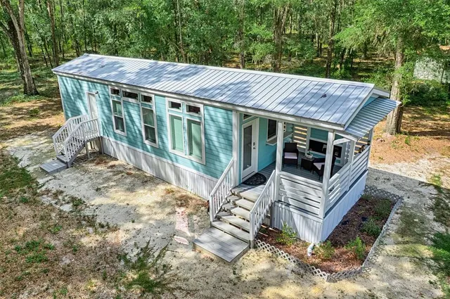 a view of a patio in the backyard