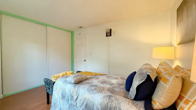 a bedroom with a bed and a window