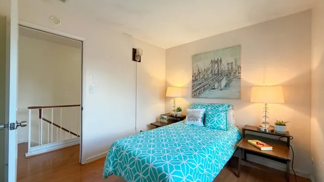 a bedroom with a bed and a window