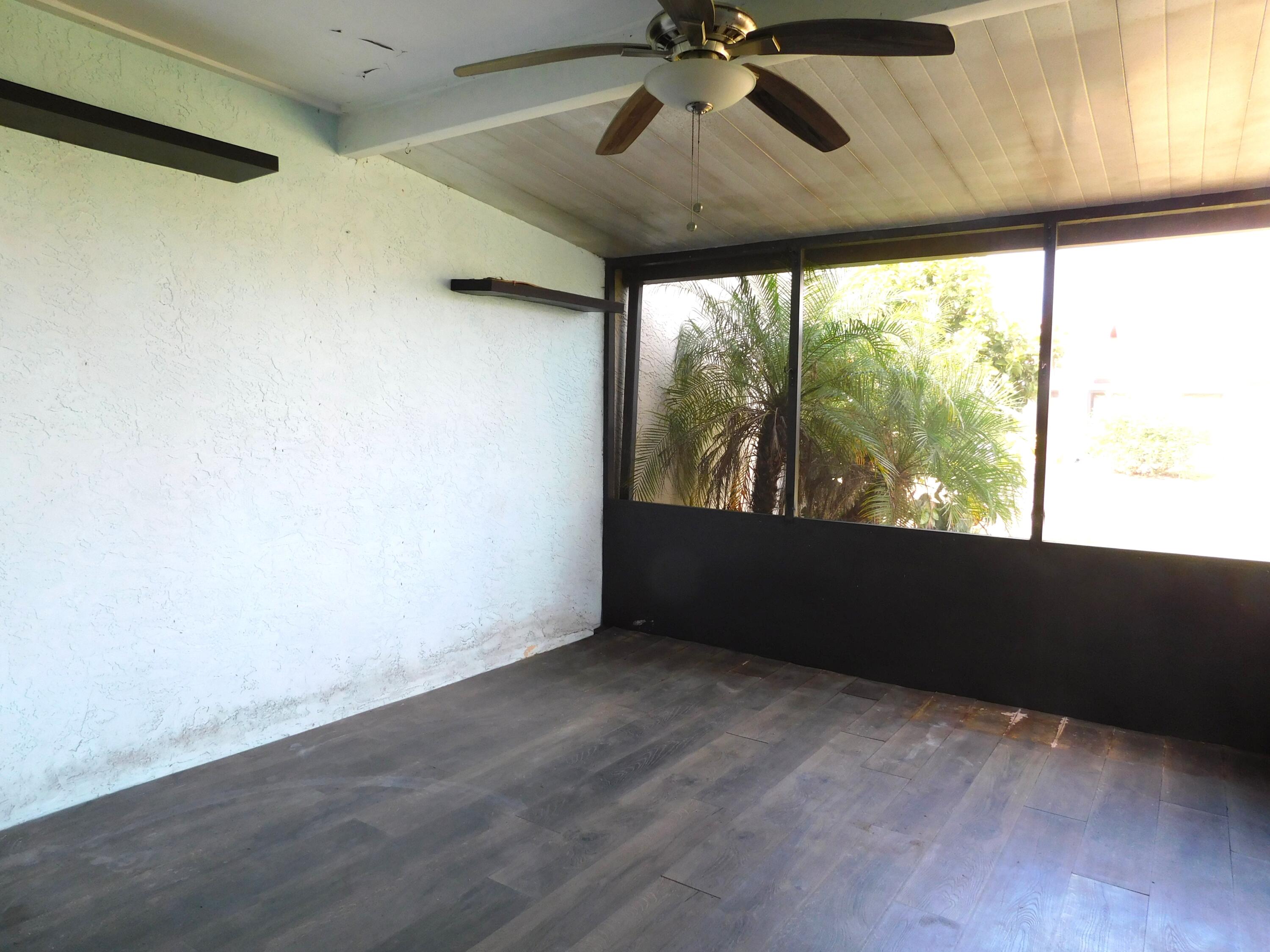 6006 Indrio Road, Unit 7 Fort Pierce, FL 34951 - Photo 17 of 22 Screen porch