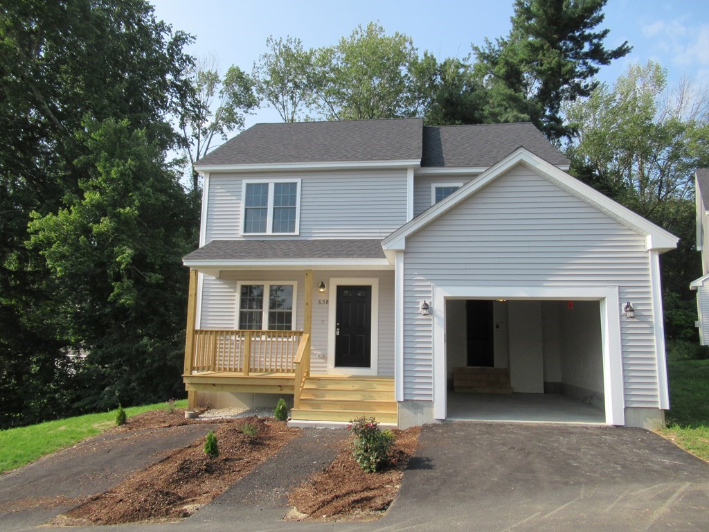 16 Farnum Street Uxbridge, MA 01569 - Photo 1 of 27 a front view of a house with a yard and garage