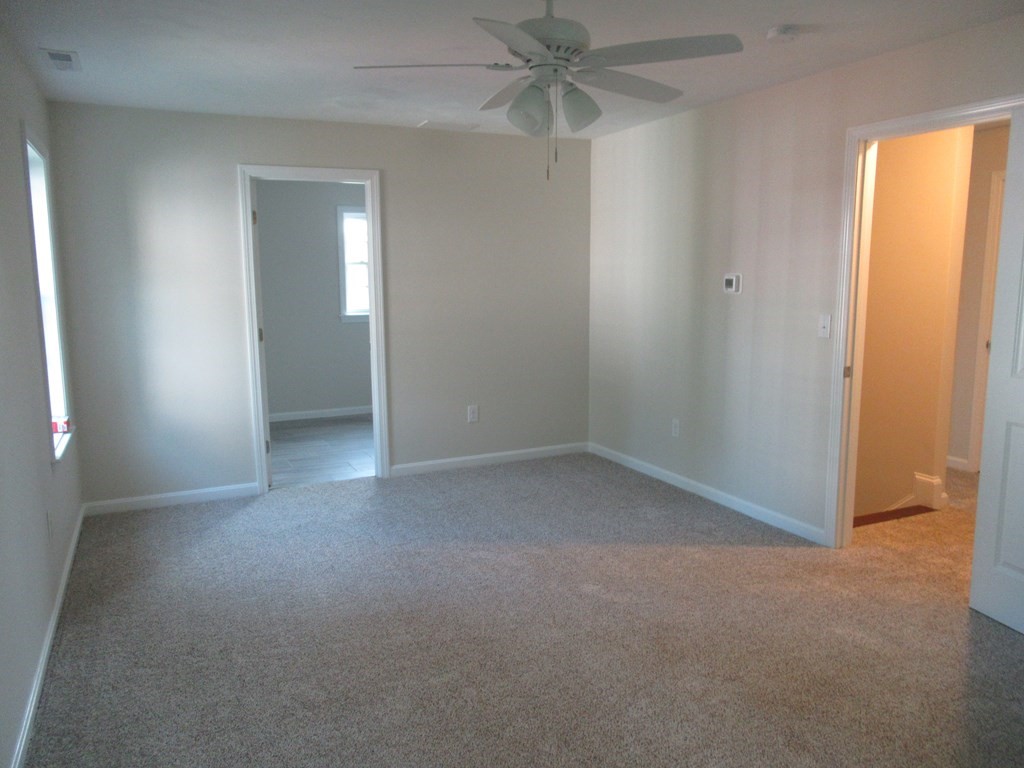 16 Farnum Street Uxbridge, MA 01569 - Photo 17 of 27 an empty room with windows and fan