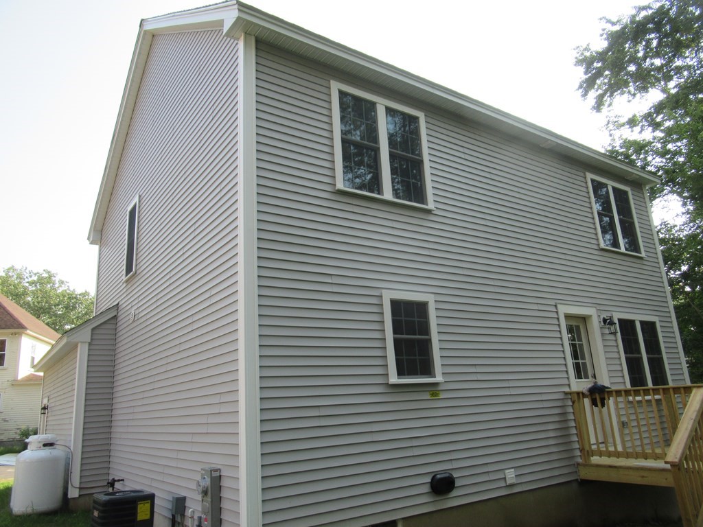 16 Farnum Street Uxbridge, MA 01569 - Photo 5 of 27 a view of a house with a balcony