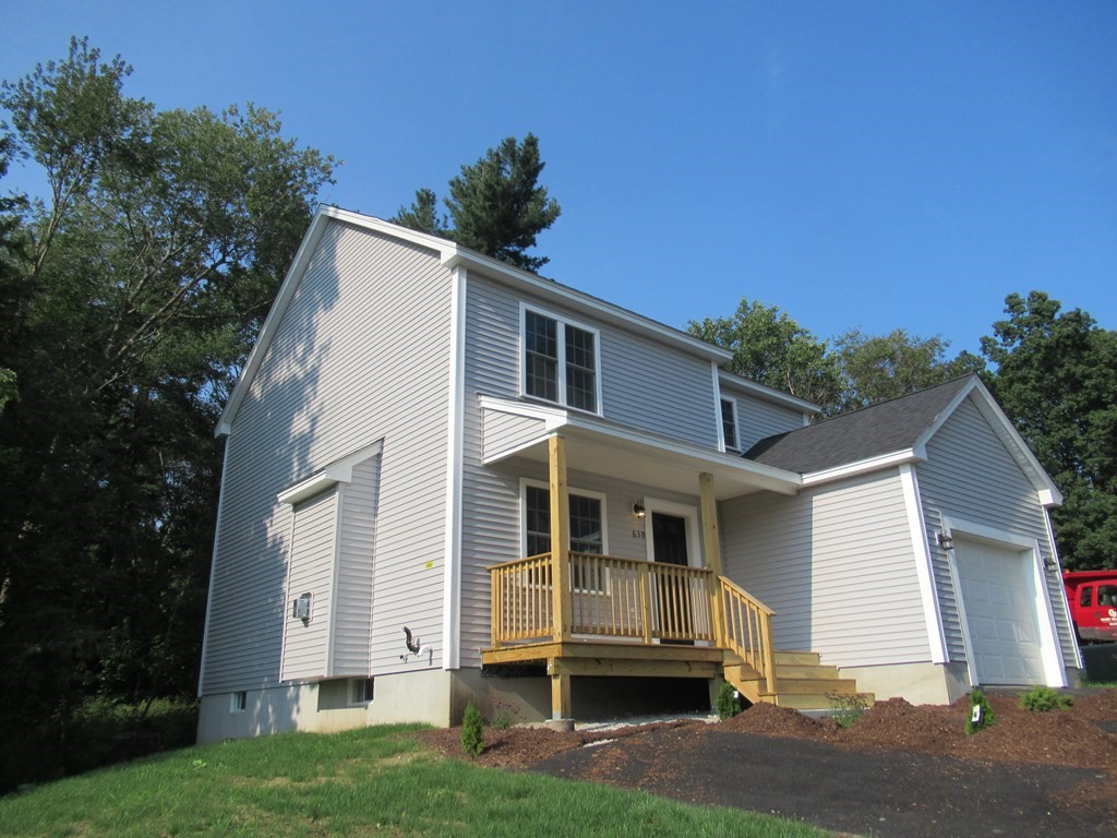 16 Farnum Street Uxbridge, MA 01569 - Photo 6 of 27 a view of a white house with a yard