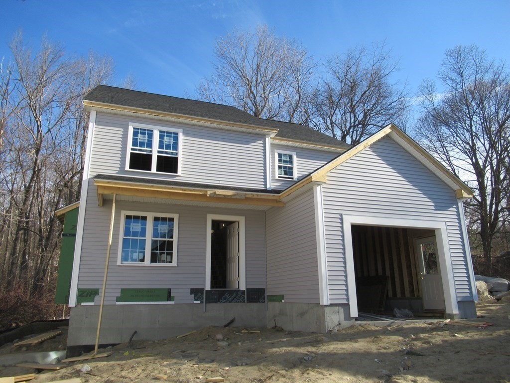 16 Farnum Street Uxbridge, MA 01569 - Photo 9 of 27 a front view of a house with a yard