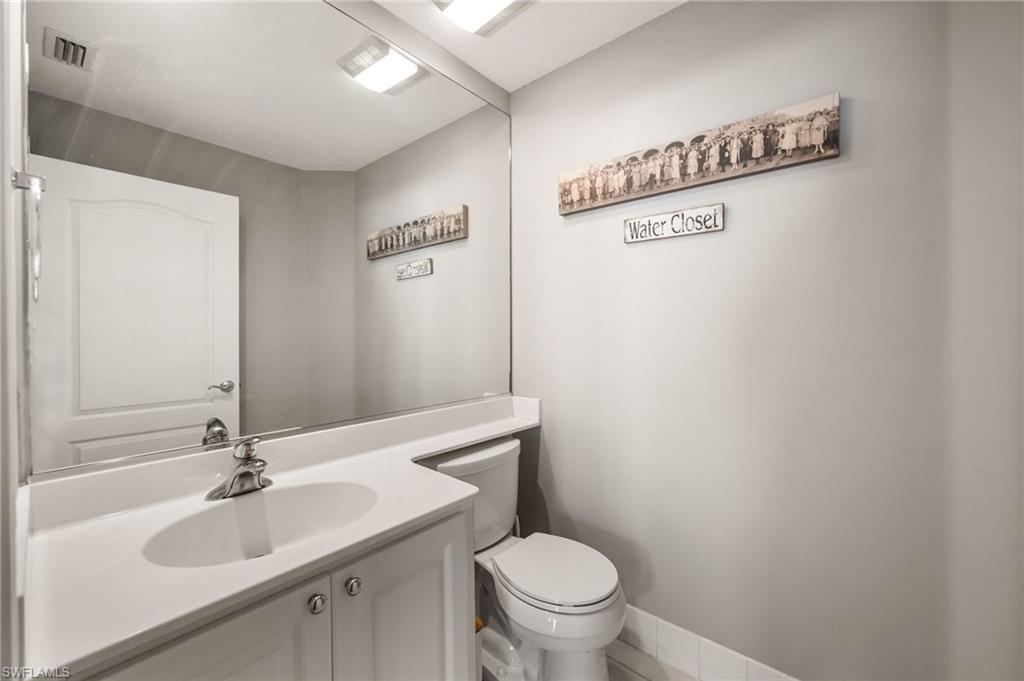 6072 Towncenter Circle Naples, FL 34119 - Photo 20 of 45 a bathroom with a sink and a toilet