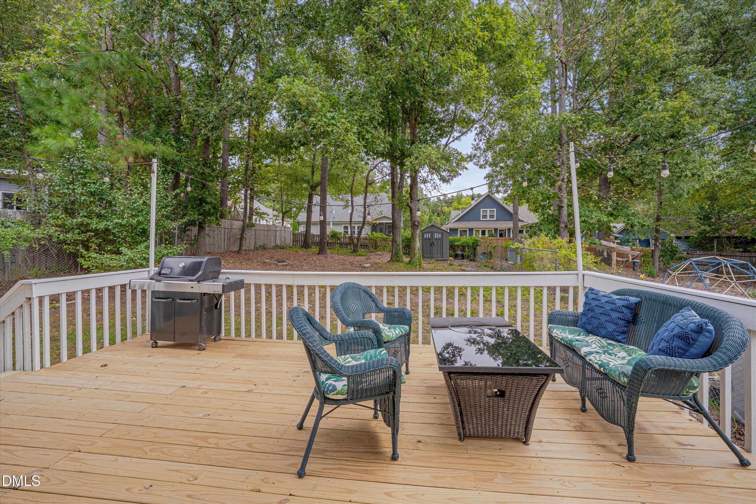 3301 Lassiter Street Durham, NC 27707 - Photo 24 of 32 a view of a deck with furniture and trees