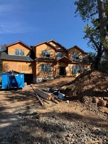 a view of multiple houses with a road