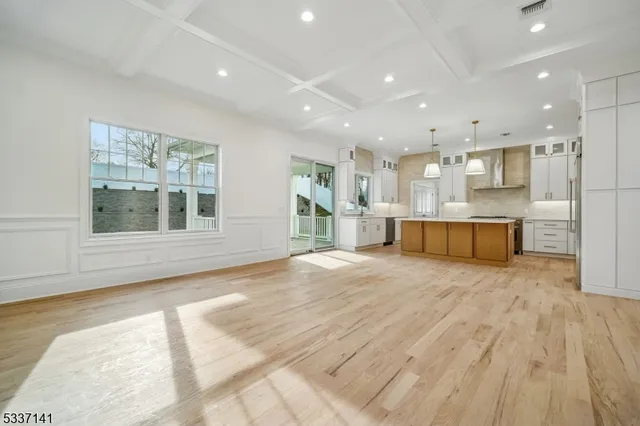 a view of kitchen and kitchen with wooden floor