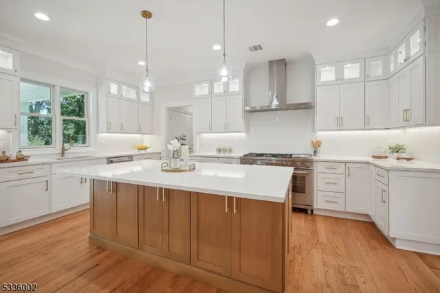 a kitchen with a sink window and cabinets