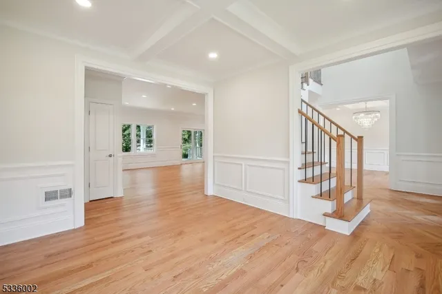 a view of an entryway with wooden floor
