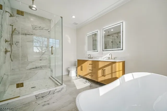 a bathroom with a bathtub and shower