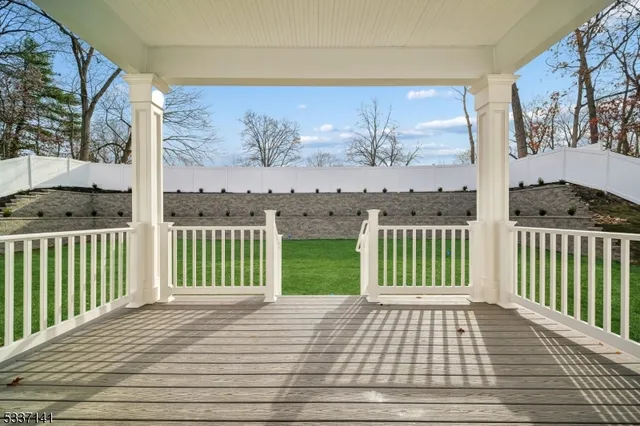 a view of a balcony with wooden floor