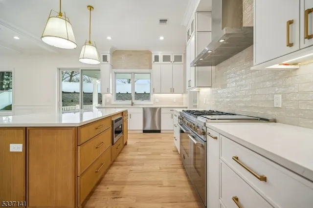 a large kitchen with a stove top oven