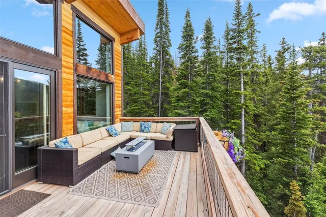 a view of balcony with couch and wooden fence