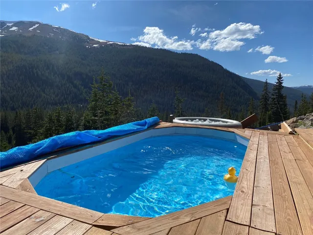 a view of a swimming pool with a yard